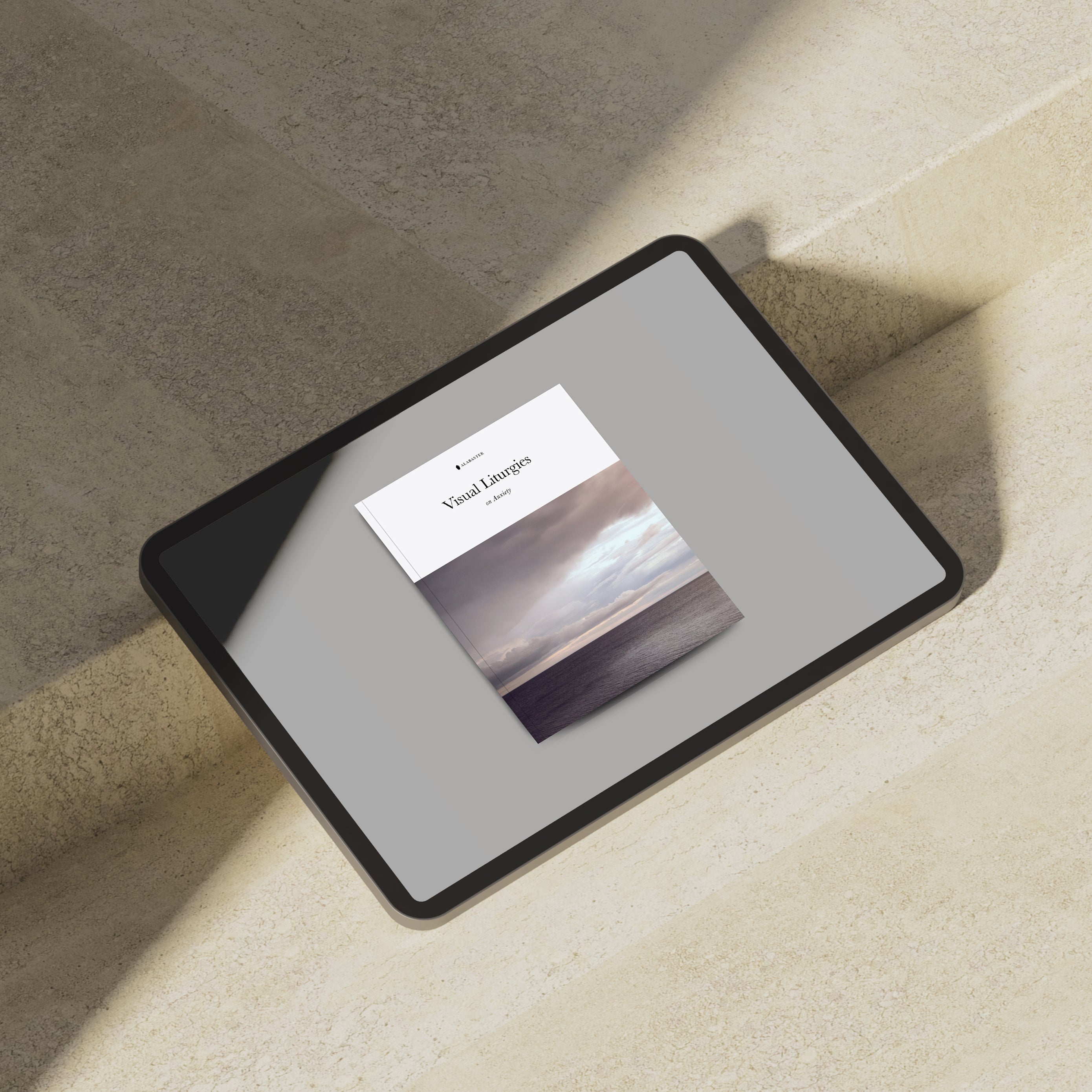 mock up of an ipad leaning against a step