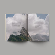The Book of Revelation open with image of clouds and mountains